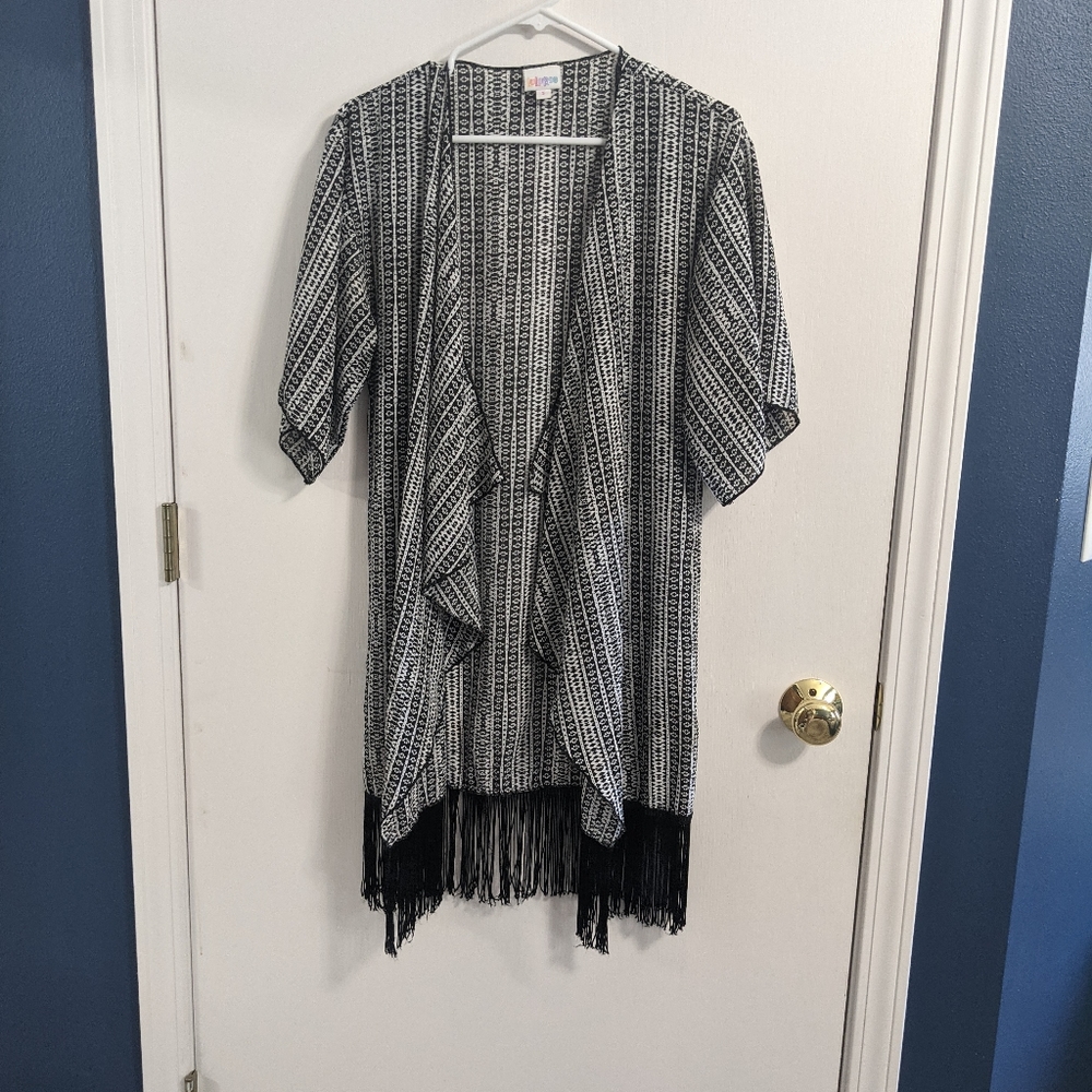 LuLaRoe cardigan. Black/white print. Fringe bottom. Open front. Size Small.